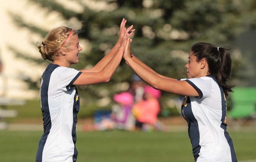 Elise Atkins and Abby Morillon celebrate after a goal